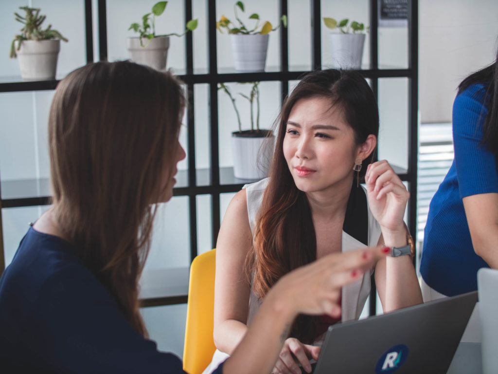 two woman talking